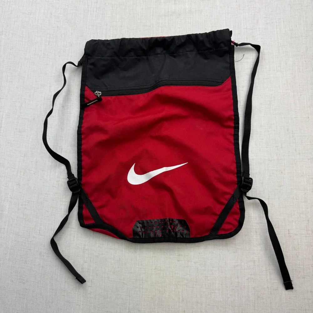 Nike Drawstring Backpack Unisex OS Red Black Swoosh Zippered Pocket Sporty Gym